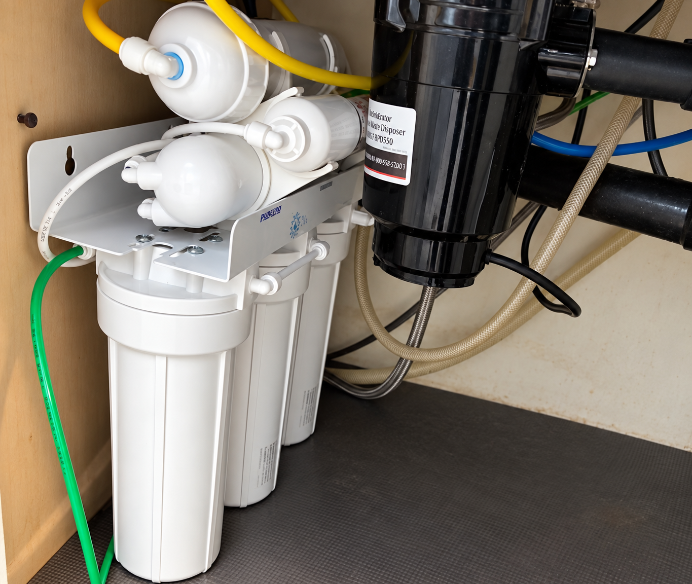 Under-sink water filtration system and garbage disposal in a Straight Flush Plumbing project